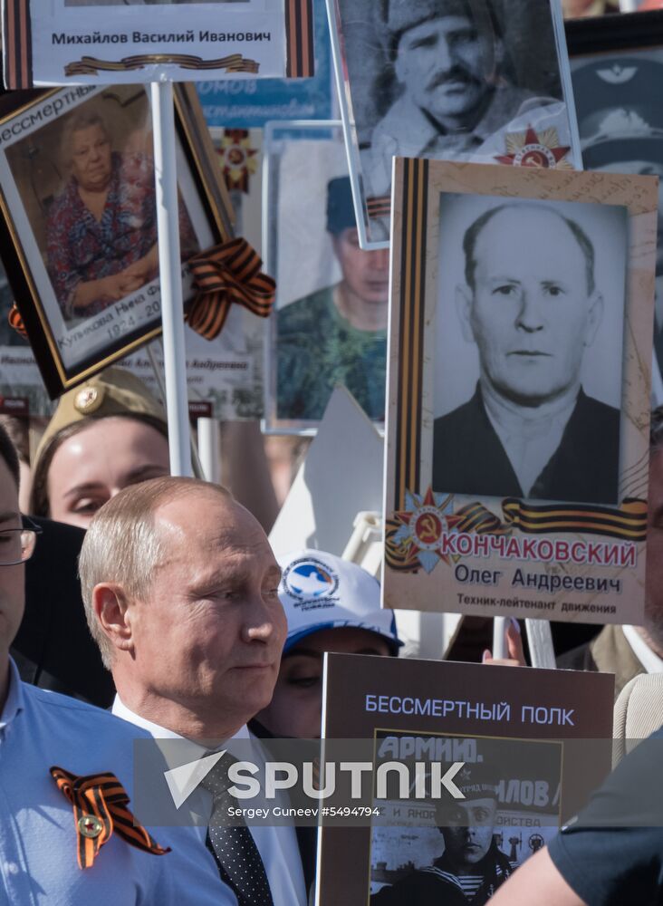 Russian President Vladimir Putin takes part in Immortal Regiment event