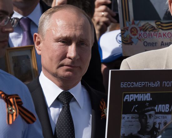 Russian President Vladimir Putin takes part in Immortal Regiment event