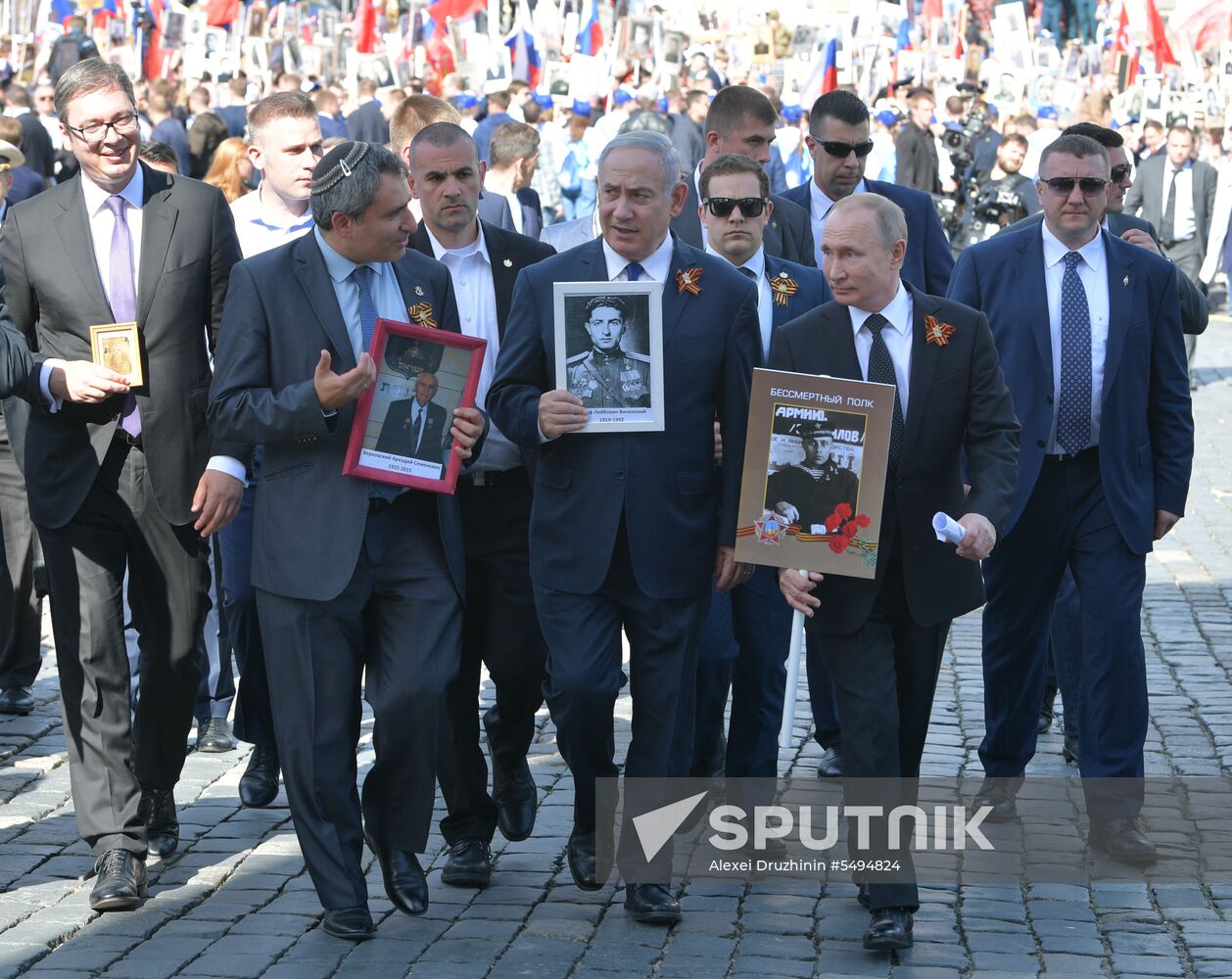 Russian President Vladimir Putin takes part in Immortal Regiment event
