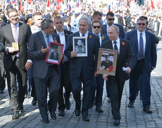 Russian President Vladimir Putin takes part in Immortal Regiment event