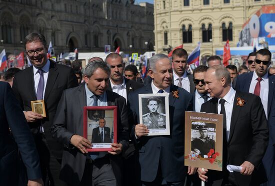 Russian President Vladimir Putin takes part in Immortal Regiment event