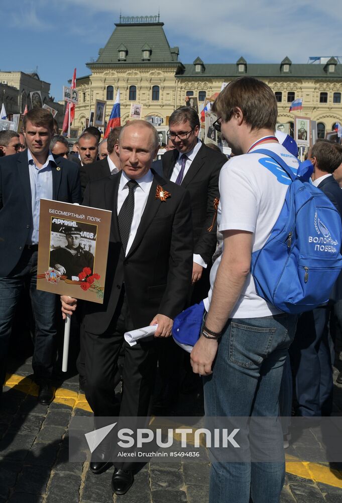 Russian President Vladimir Putin takes part in Immortal Regiment event