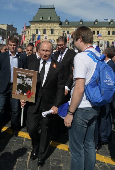 Russian President Vladimir Putin takes part in Immortal Regiment event