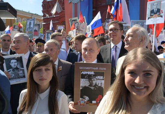 Russian President Vladimir Putin takes part in Immortal Regiment event