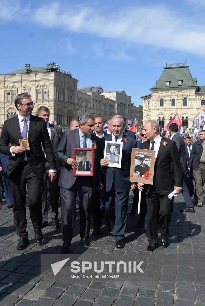 Russian President Vladimir Putin takes part in Immortal Regiment event