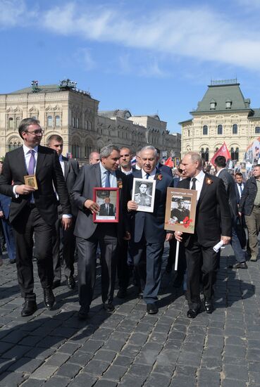 Russian President Vladimir Putin takes part in Immortal Regiment event