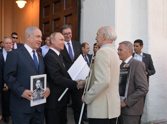 Russian President Vladimir Putin takes part in Immortal Regiment event