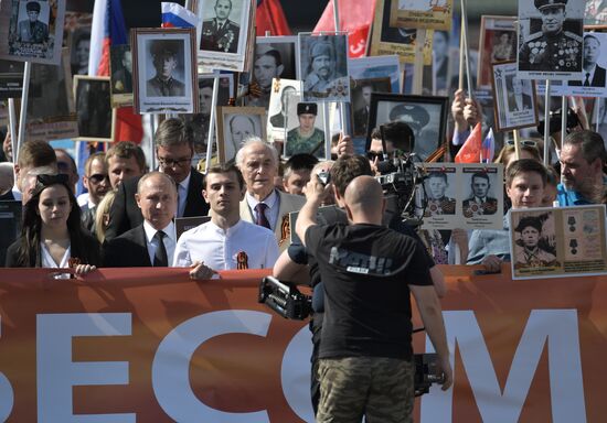 Russian President Vladimir Putin takes part in Immortal Regiment event