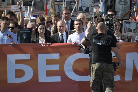 Russian President Vladimir Putin takes part in Immortal Regiment event