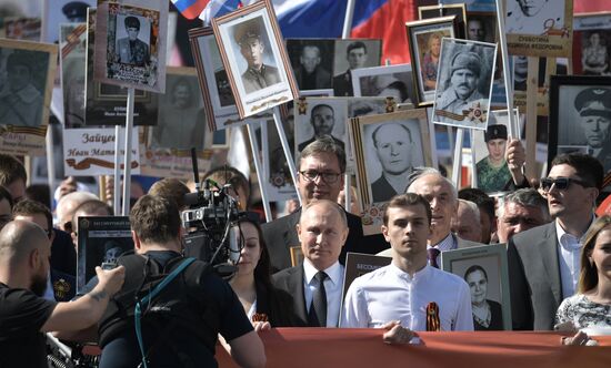 Russian President Vladimir Putin takes part in Immortal Regiment event