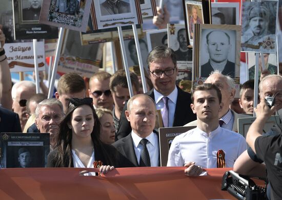 Russian President Vladimir Putin takes part in Immortal Regiment event