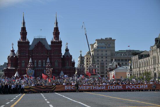 Russian President Vladimir Putin takes part in Immortal Regiment event
