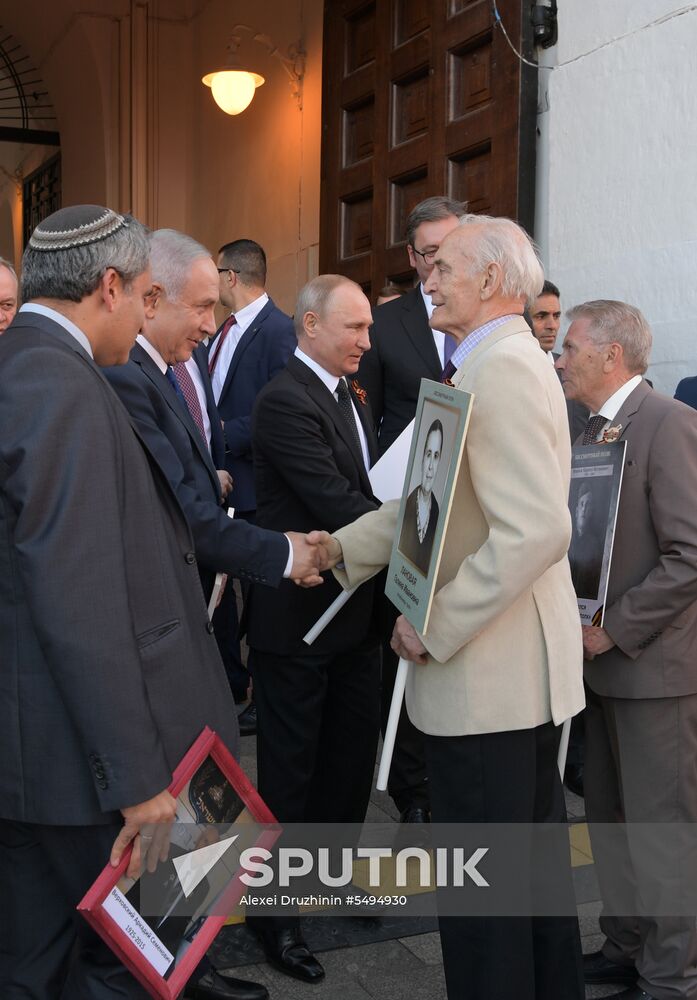 Russian President Vladimir Putin takes part in Immortal Regiment event
