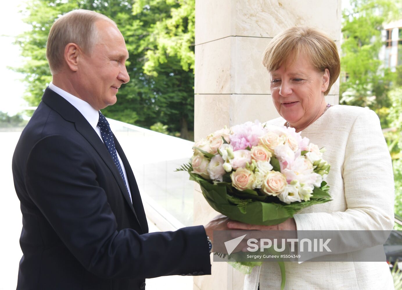 President Vladimir Putin meets with German Chancellor Angela Merkel