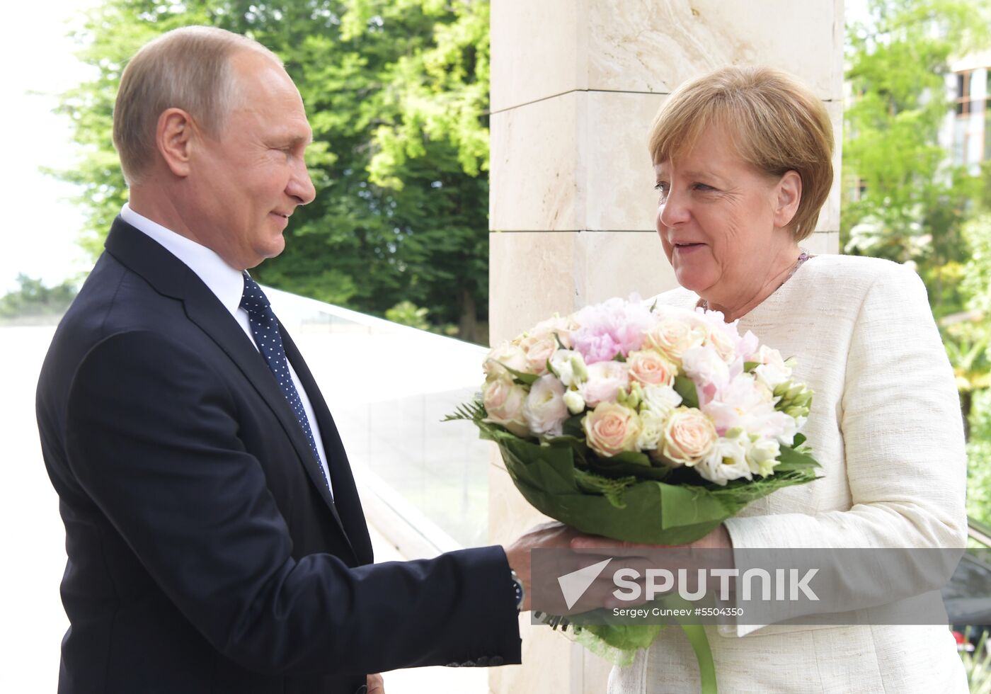President Vladimir Putin meets with German Chancellor Angela Merkel