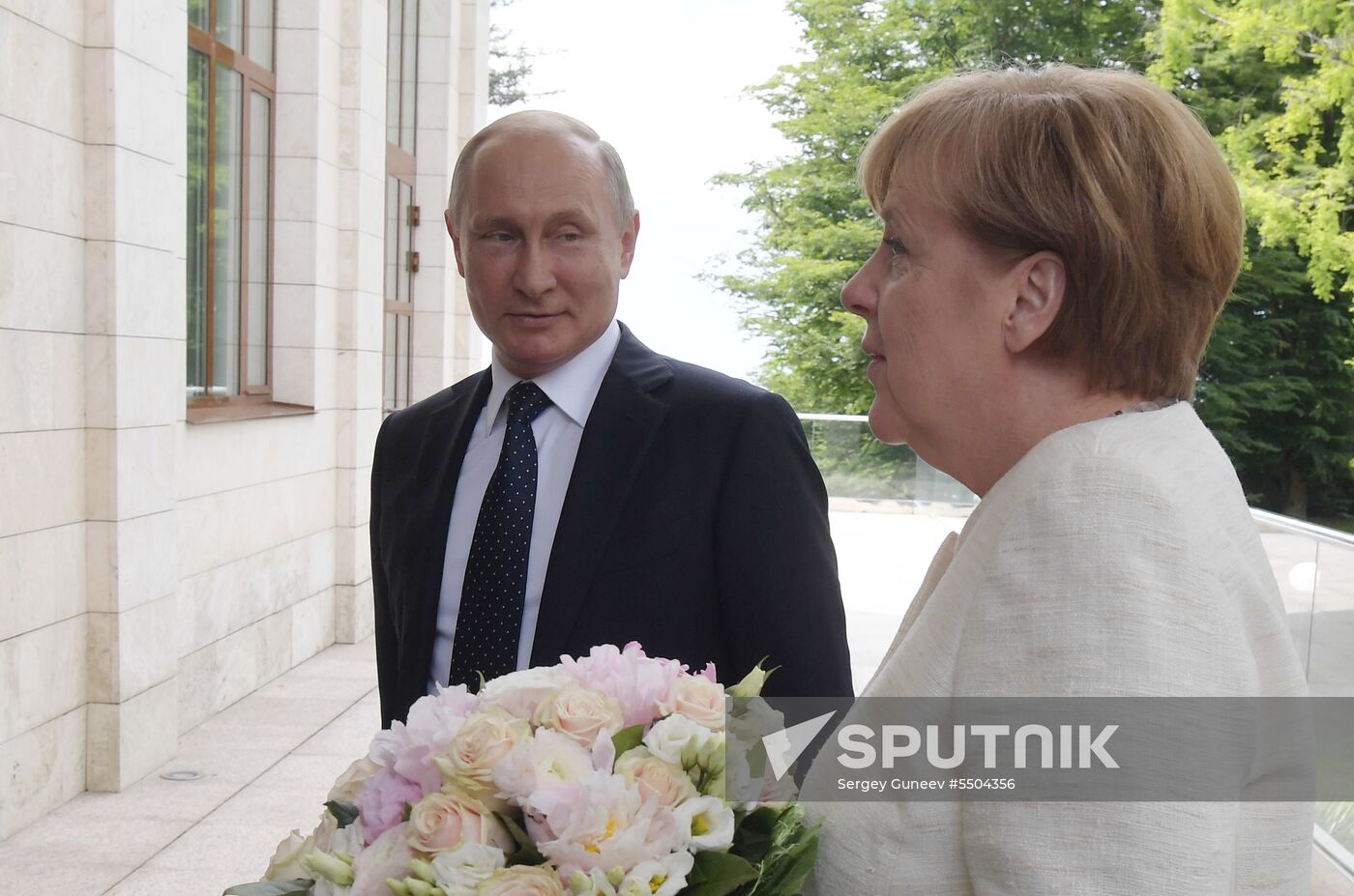 President Vladimir Putin meets with German Chancellor Angela Merkel