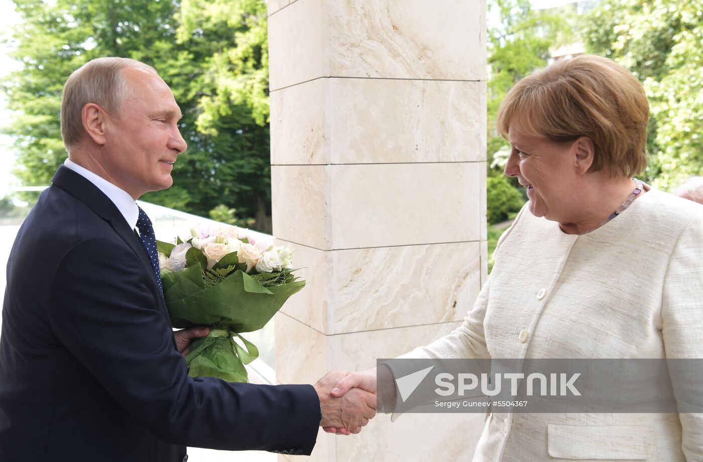 President Vladimir Putin meets with German Chancellor Angela Merkel