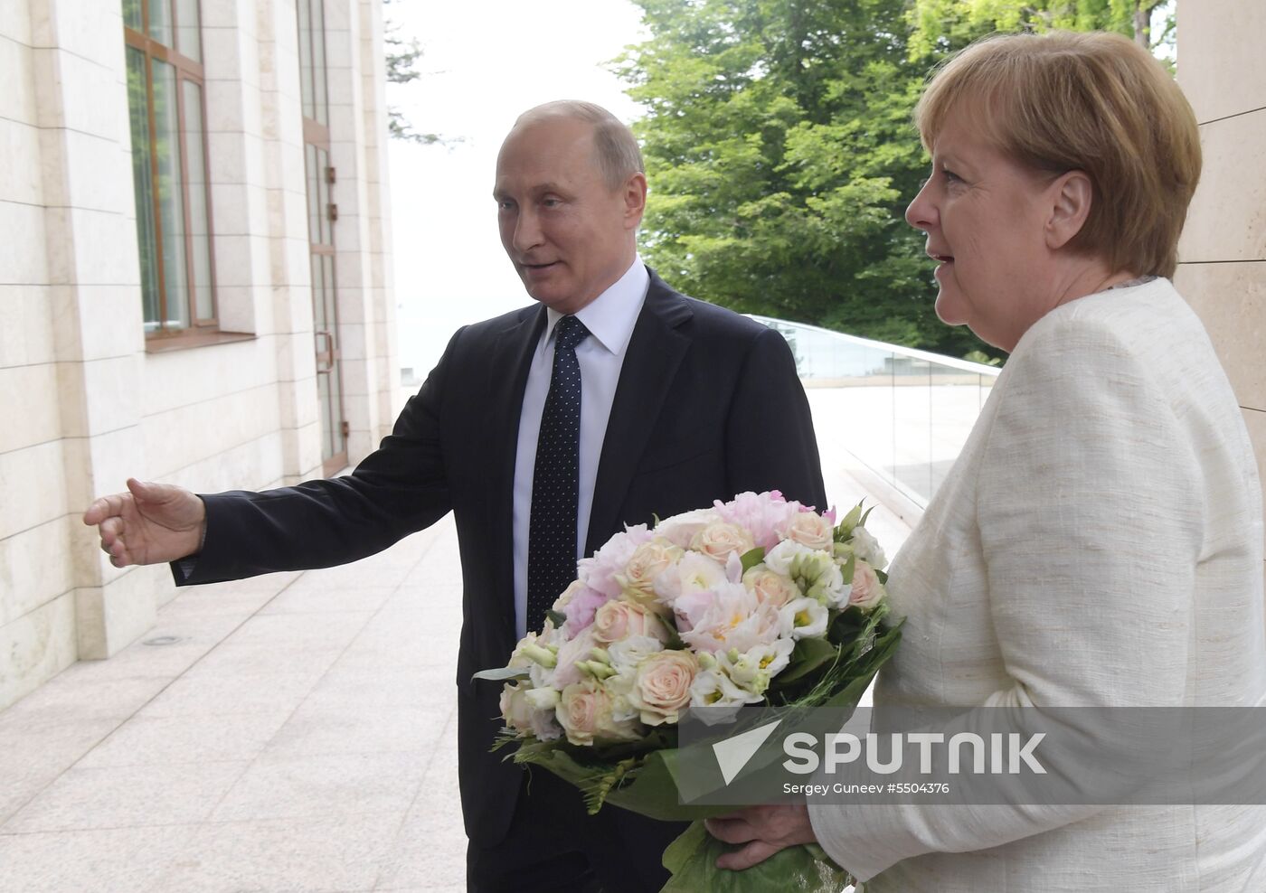 President Vladimir Putin meets with German Chancellor Angela Merkel