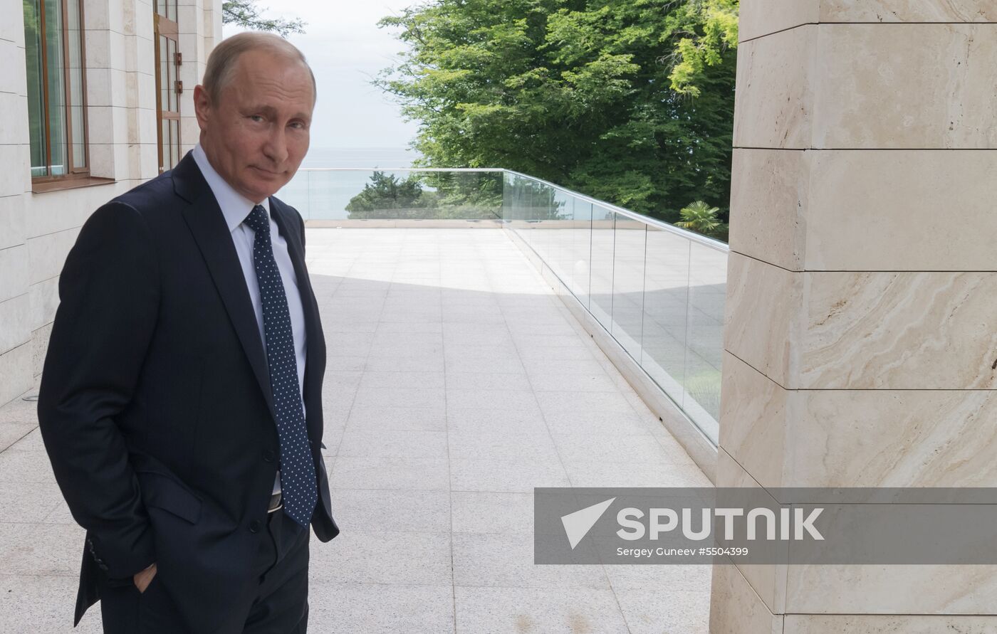 President Vladimir Putin meets with German Chancellor Angela Merkel