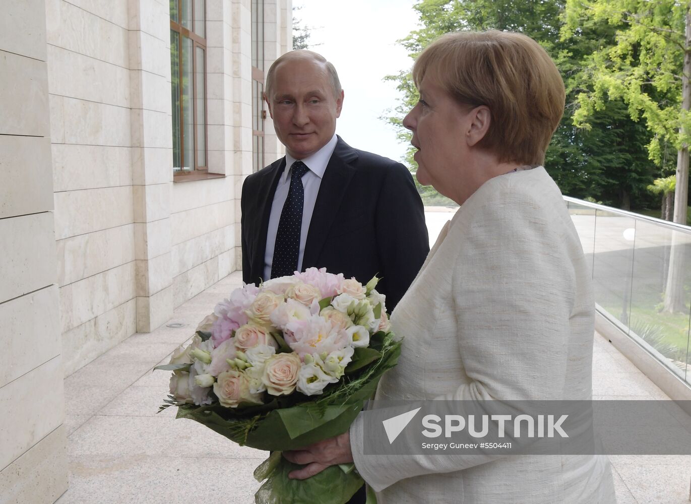 President Vladimir Putin meets with German Chancellor Angela Merkel