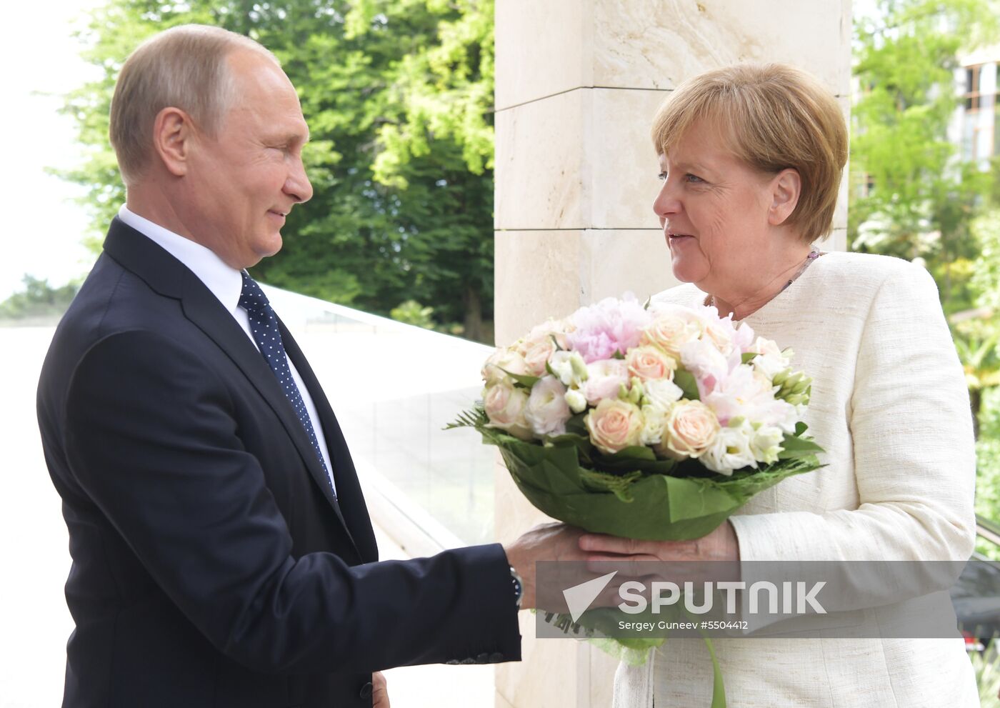President Vladimir Putin meets with German Chancellor Angela Merkel