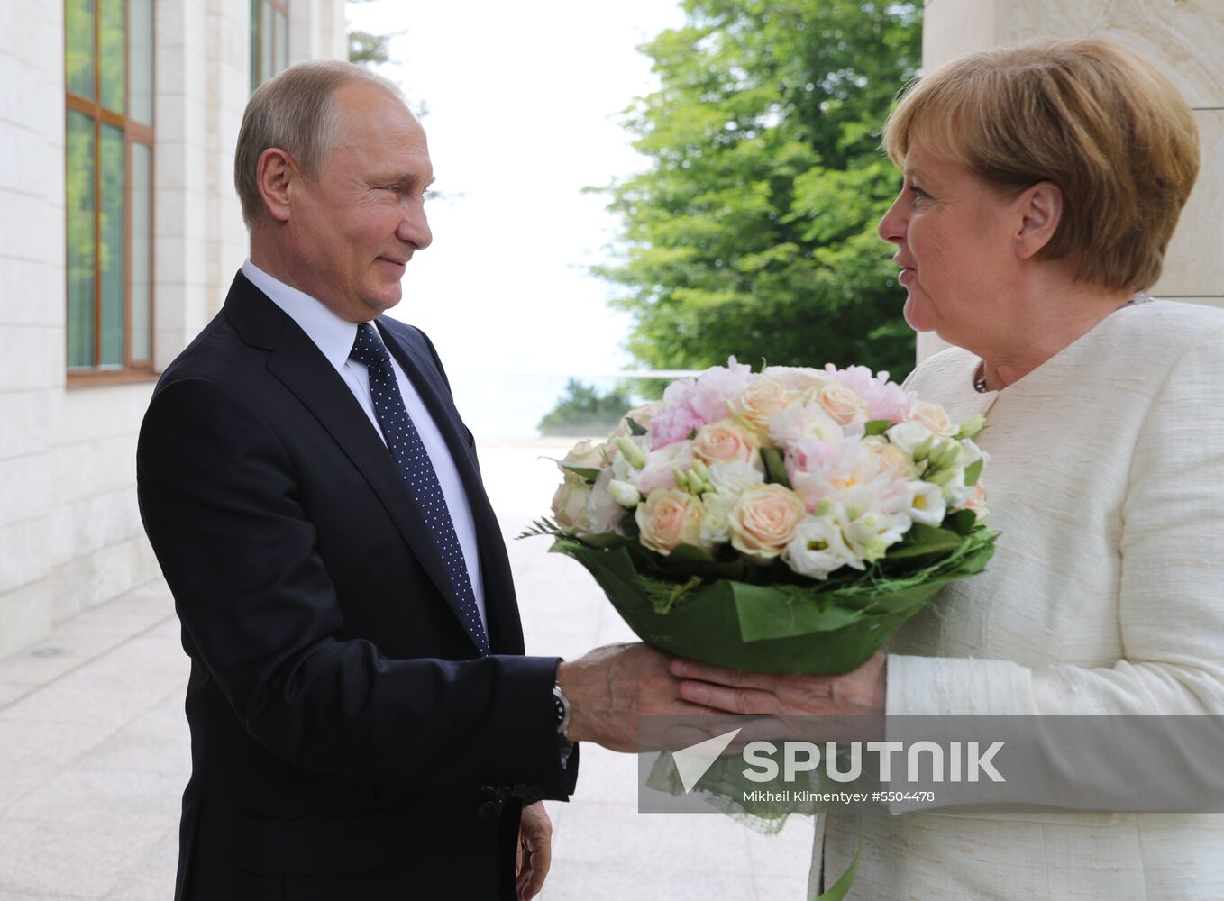 President Vladimir Putin meets with German Chancellor Angela Merkel