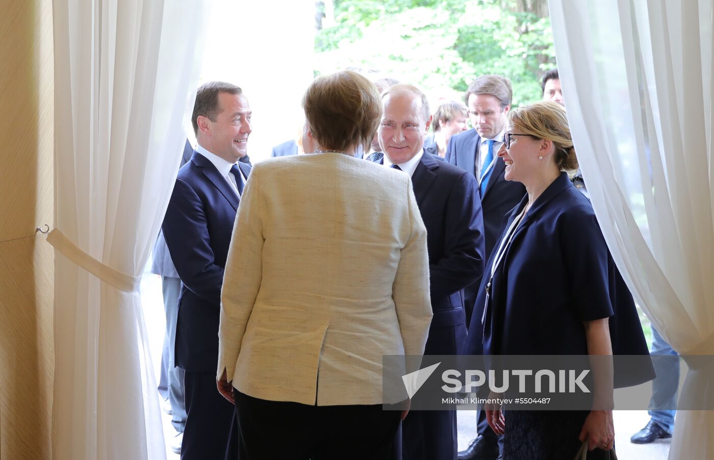 President Vladimir Putin meets with German Chancellor Angela Merkel