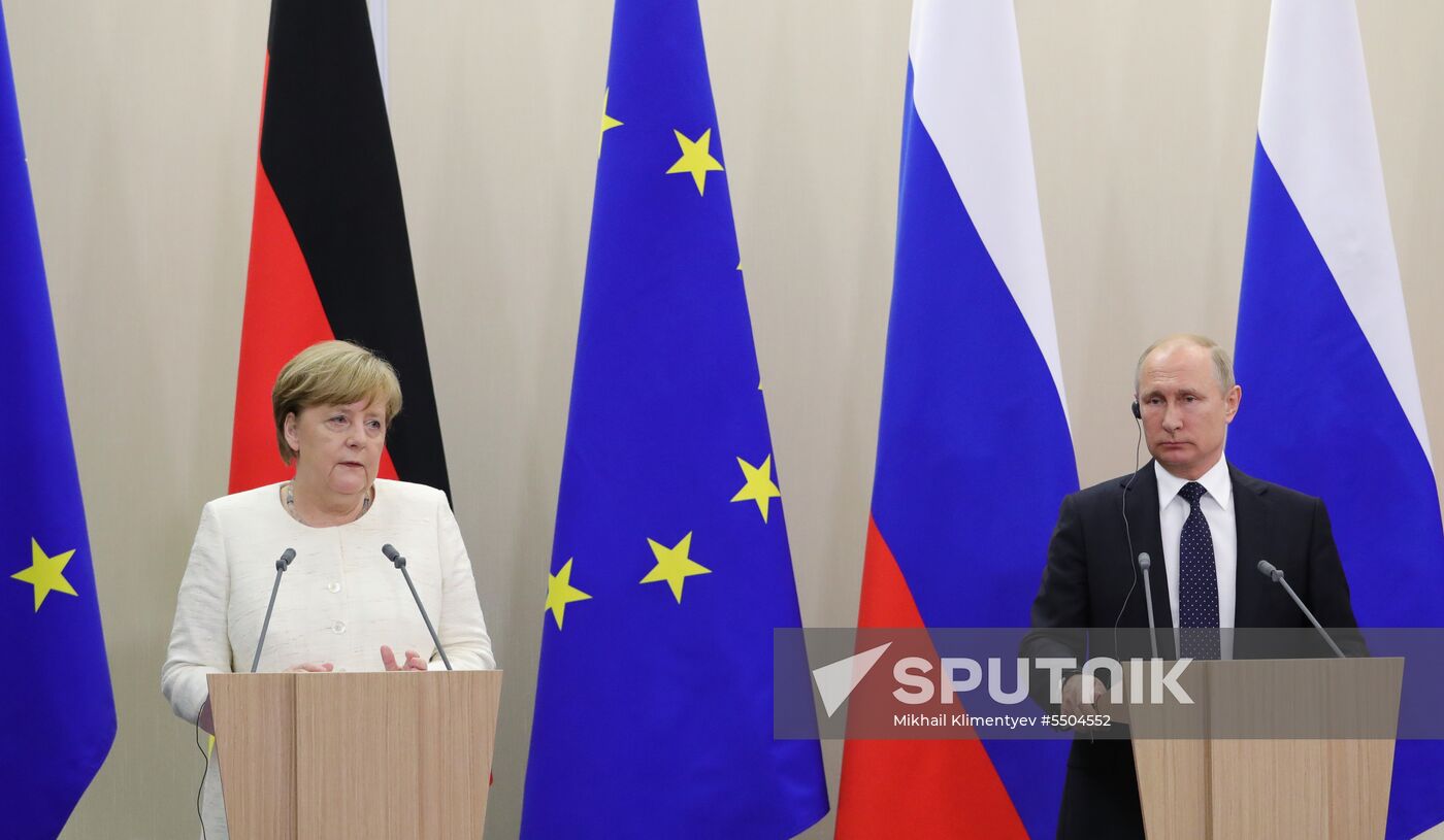 President Vladimir Putin meets with German Chancellor Angela Merkel