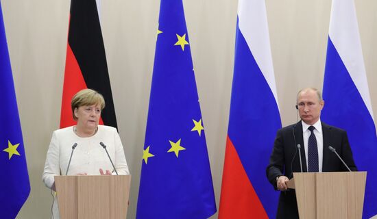 President Vladimir Putin meets with German Chancellor Angela Merkel