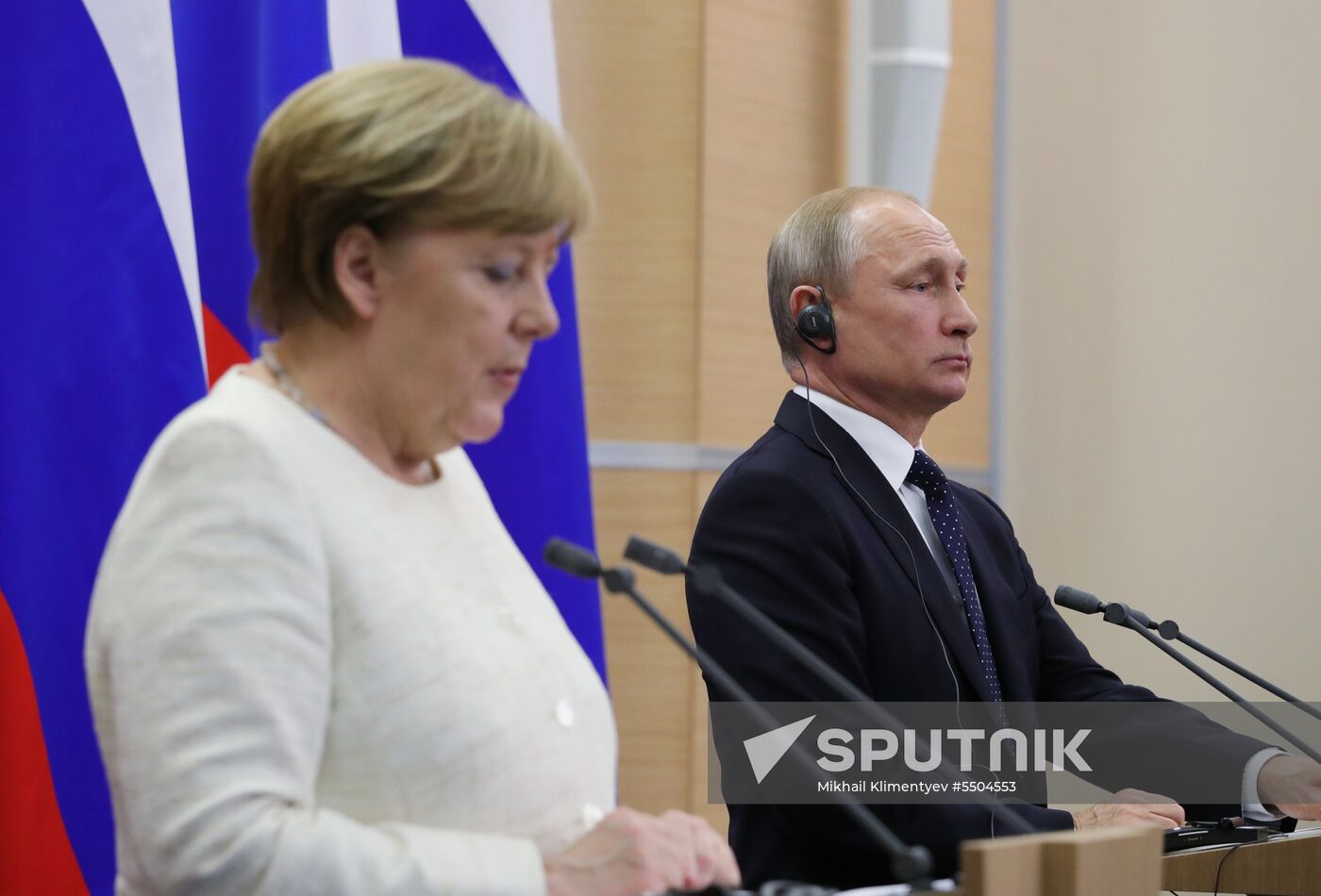 President Vladimir Putin meets with German Chancellor Angela Merkel