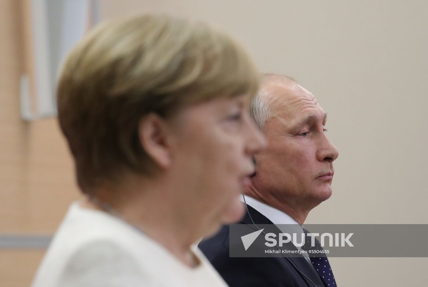 President Vladimir Putin meets with German Chancellor Angela Merkel