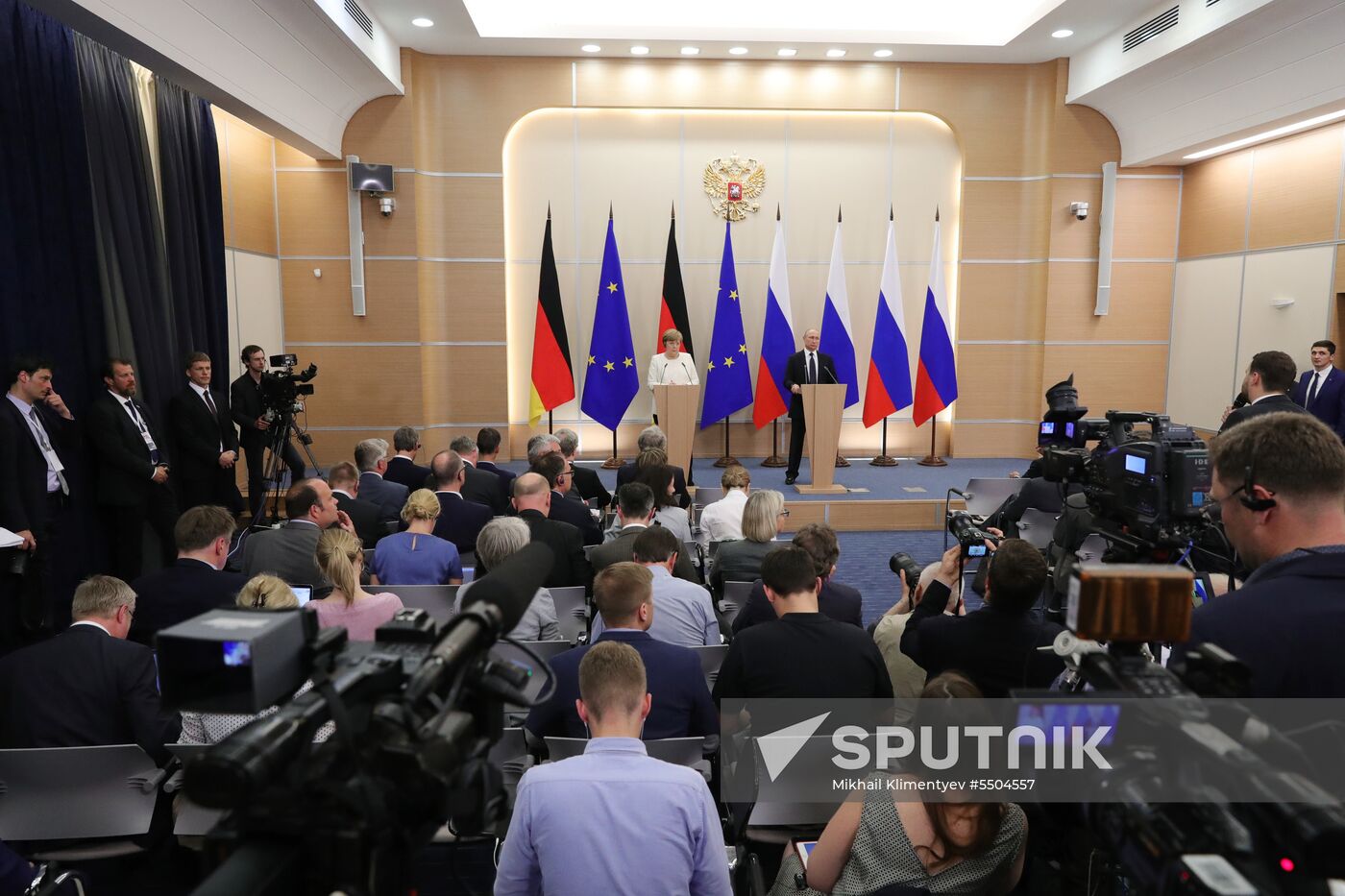 President Vladimir Putin meets with German Chancellor Angela Merkel
