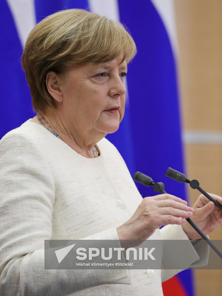 President Vladimir Putin meets with German Chancellor Angela Merkel