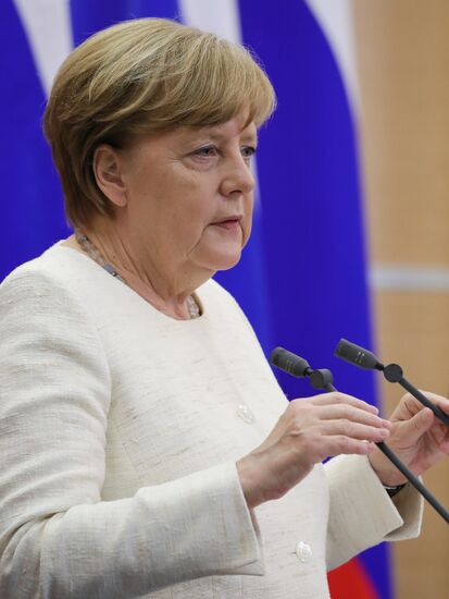 President Vladimir Putin meets with German Chancellor Angela Merkel