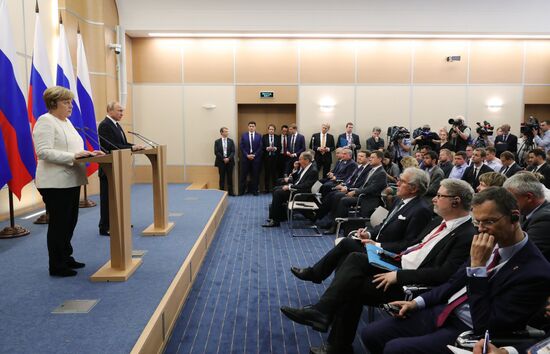 President Vladimir Putin meets with German Chancellor Angela Merkel