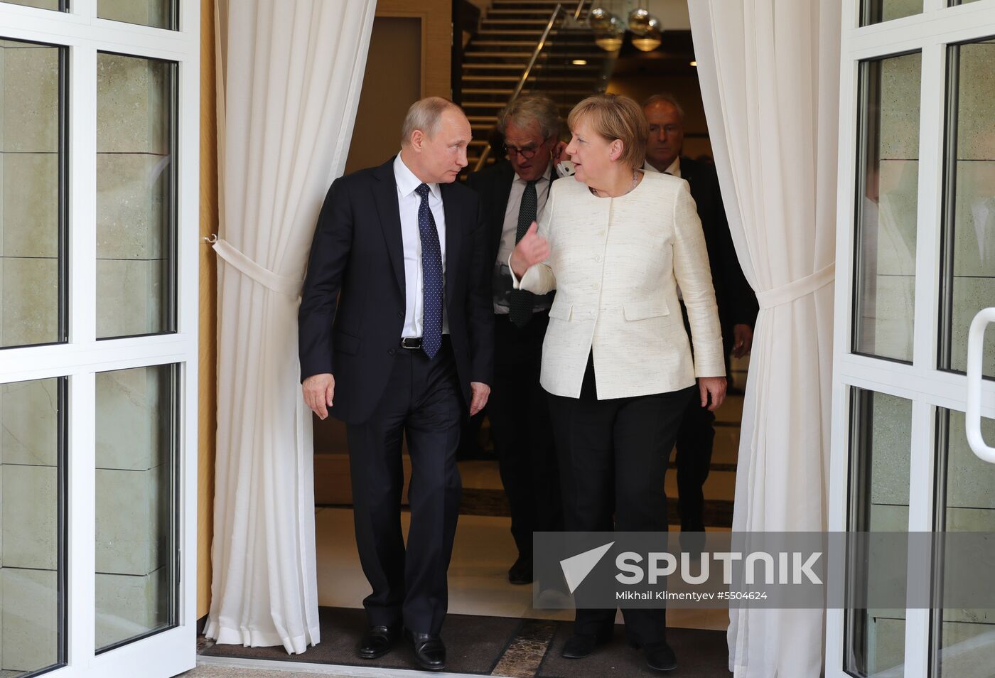 President Vladimir Putin meets with German Chancellor Angela Merkel