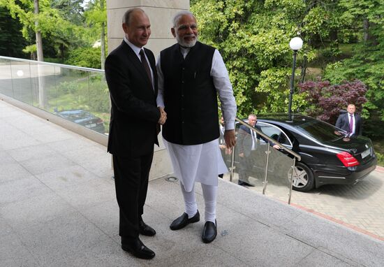 President Vladimir Putin meets with Indian Prime Minister Narendra Modi