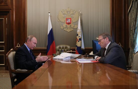 Russian President Vladimir Putin meets with Commissioner for Entrepreneurs' Rights Boris Titov