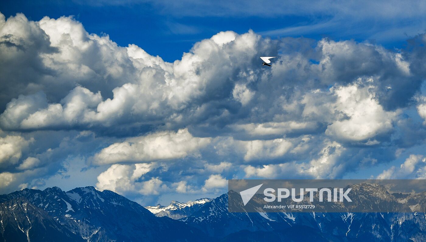 Paragliders fly over Stubaital valley in Austria