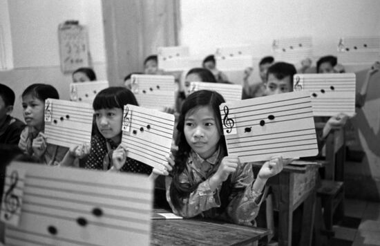 Vietnamese schoolchildren at music lesson