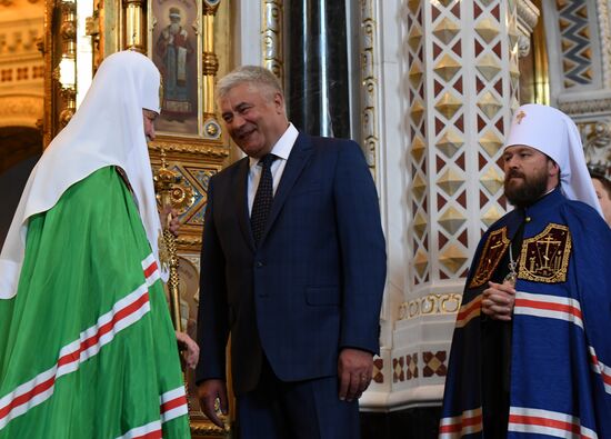 Russian Minister of Internal Affairs Vladimir Kolokoltsev passes ancient icons to Patriarch Kirill