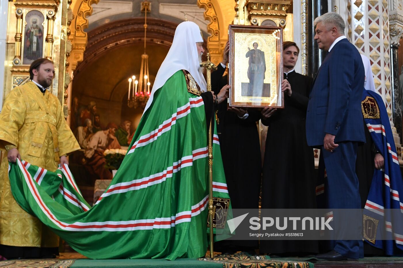 Russian Minister of Internal Affairs Vladimir Kolokoltsev passes ancient icons to Patriarch Kirill