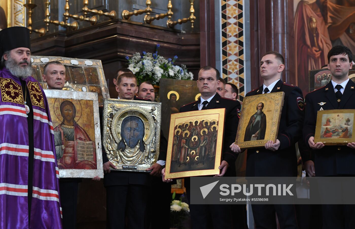 Russian Minister of Internal Affairs Vladimir Kolokoltsev passes ancient icons to Patriarch Kirill