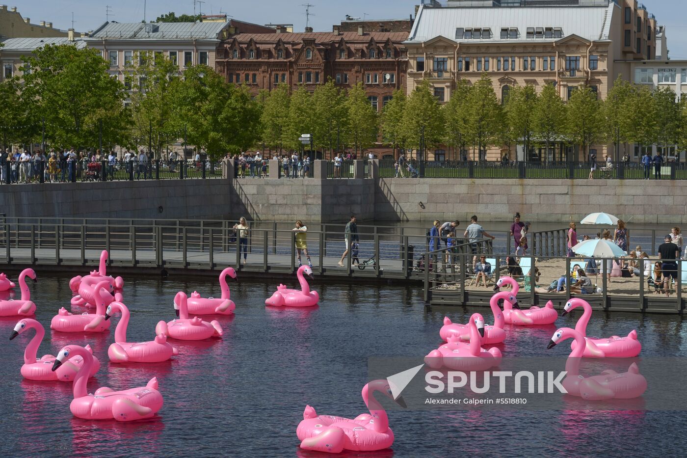 Beach with inflatable pink flamingos opens on St. Petersburg's New Holland Island