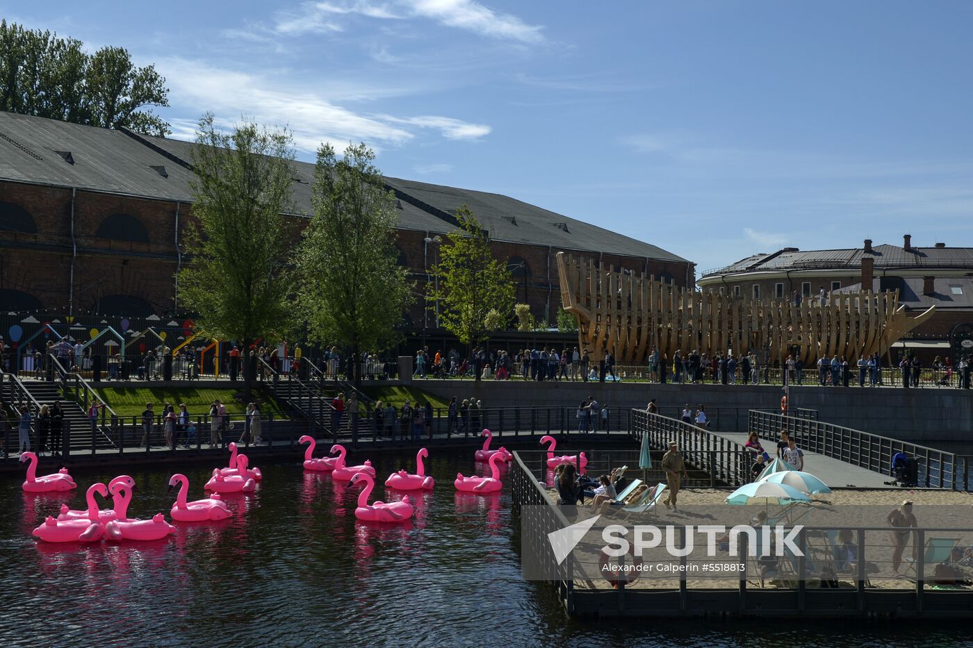 Beach with inflatable pink flamingos opens on St. Petersburg's New Holland Island