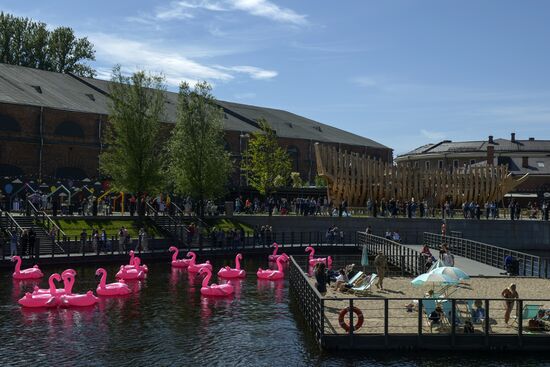 Beach with inflatable pink flamingos opens on St. Petersburg's New Holland Island