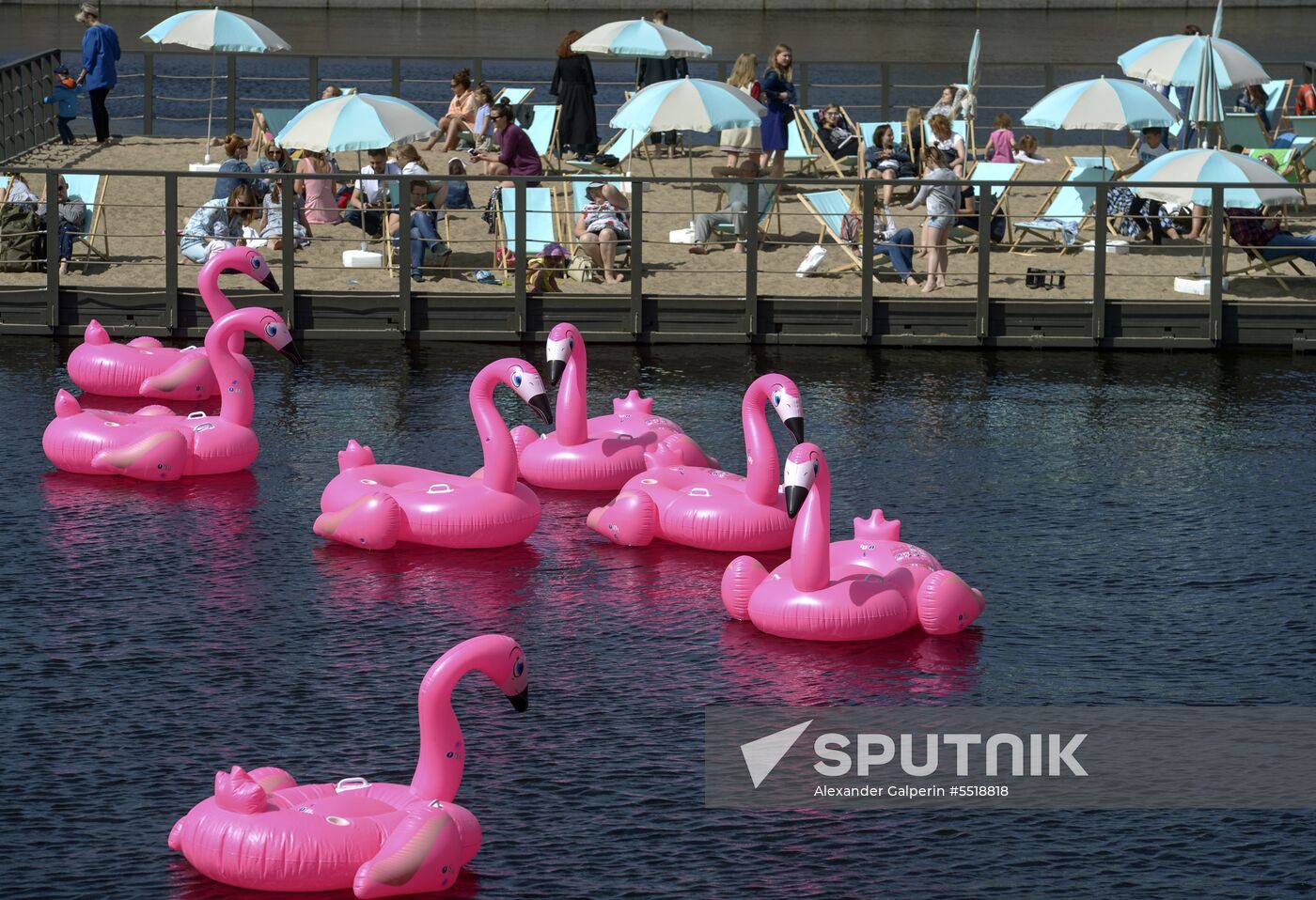 Beach with inflatable pink flamingos opens on St. Petersburg's New Holland Island
