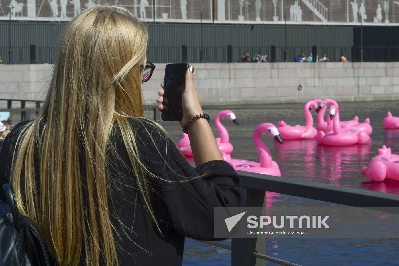 Beach with inflatable pink flamingos opens on St. Petersburg's New Holland Island