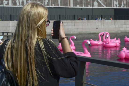 Beach with inflatable pink flamingos opens on St. Petersburg's New Holland Island
