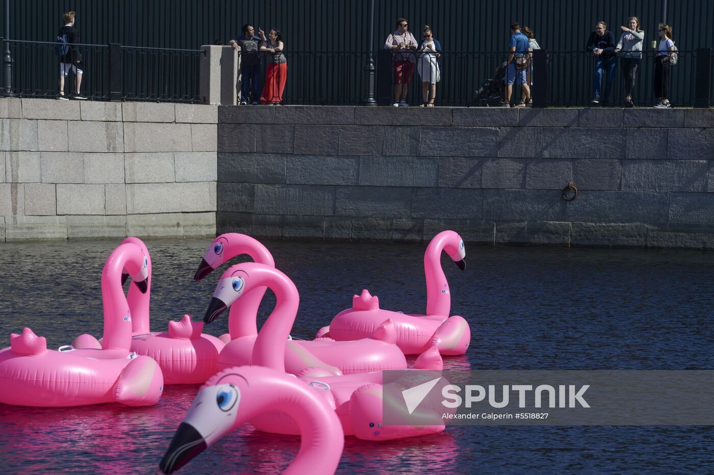 Beach with inflatable pink flamingos opens on St. Petersburg's New Holland Island